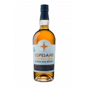 A bottle of Merchants' Quay blended Irish whiskey by Copeland Distillery, with a still from the distillery in the background.
