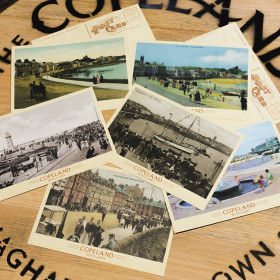 Copeland Distillery Postcards laying on top of a cask